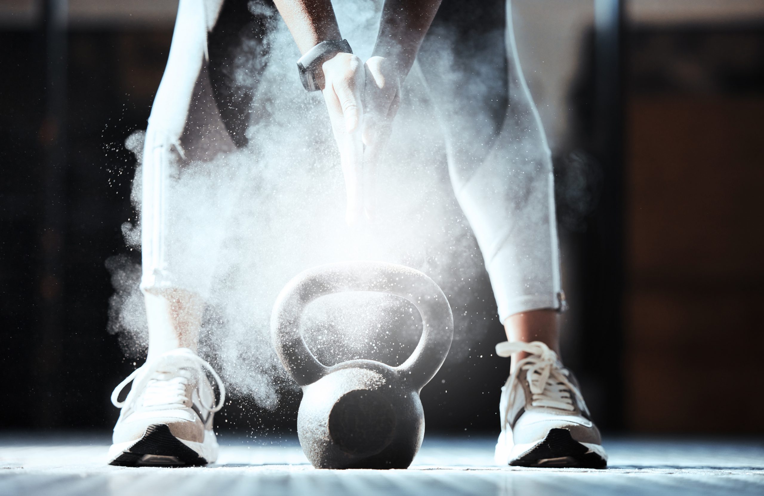 fitness-hands-powder-kettlebell-gym-workout-exercise-sports-training-closeup-athlete-legs-bodybuilder-with-heavy-weight-equipment-chalk-dust-strong-performance-power